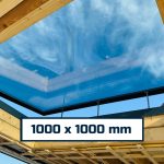 Clear sky viewed through a glass skylight.